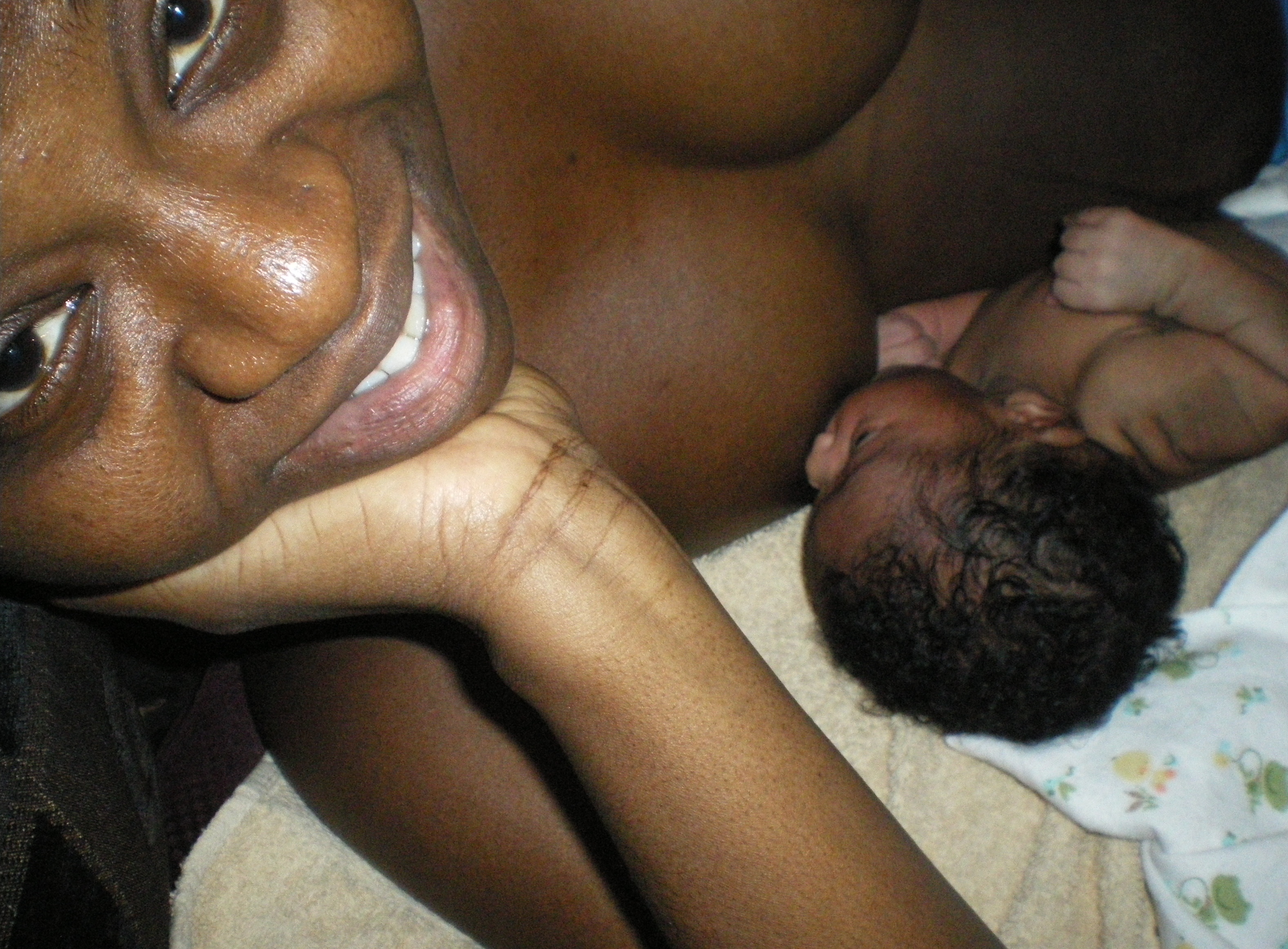This is what I found when I googled: "African woman breastfeeding baby...